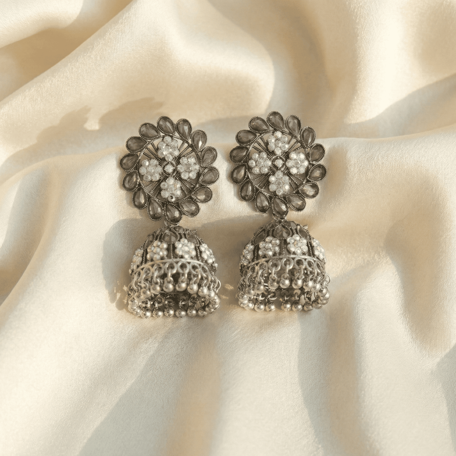 Oxidised Floral Jhumka Earrings with Clear Stones